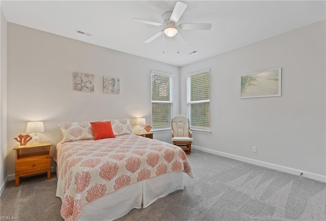 bedroom featuring a ceiling fan, carpet flooring, visible vents, and baseboards