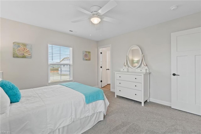 bedroom with carpet, ceiling fan, and baseboards