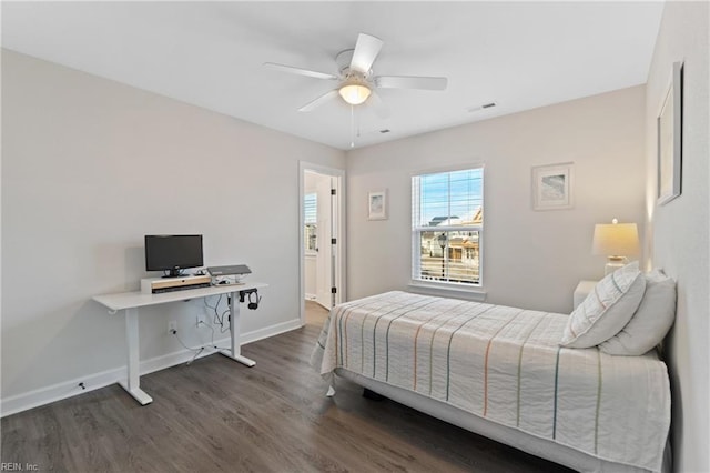 bedroom with dark wood-type flooring, visible vents, baseboards, and a ceiling fan