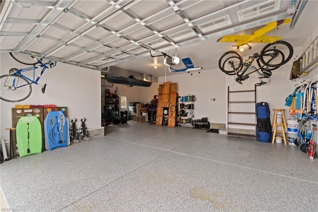 garage featuring a garage door opener