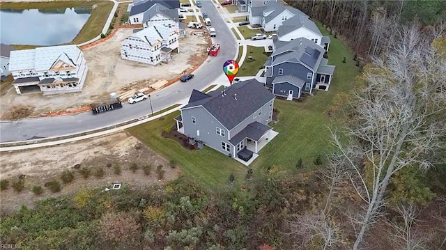 aerial view featuring a water view and a residential view