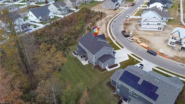 birds eye view of property with a residential view