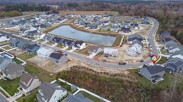 aerial view with a residential view and a water view