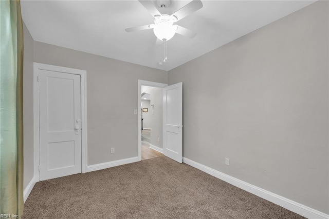 unfurnished bedroom featuring carpet flooring, ceiling fan, and baseboards