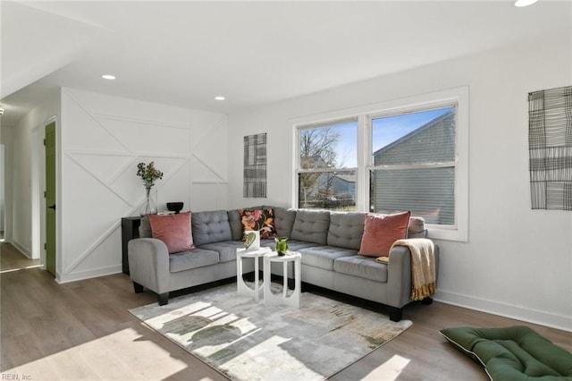 living area featuring recessed lighting, baseboards, and wood finished floors