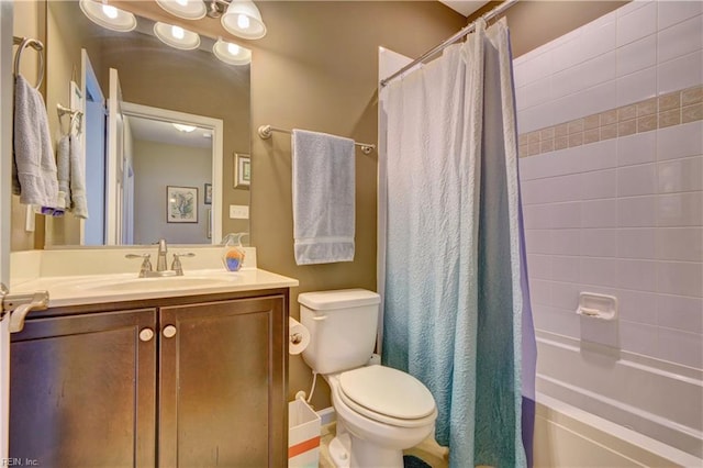 bathroom with toilet, shower / bath combo with shower curtain, and vanity