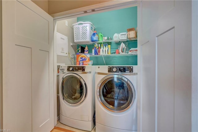 laundry area with laundry area and washer and clothes dryer