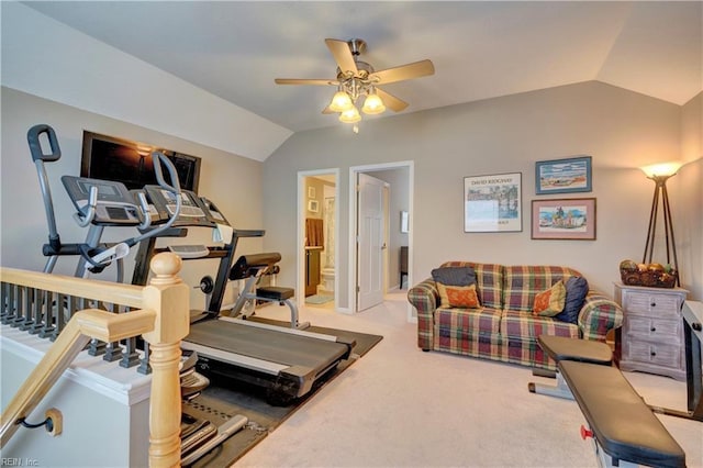 exercise room with ceiling fan, vaulted ceiling, and carpet flooring