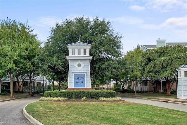 view of property's community with a yard