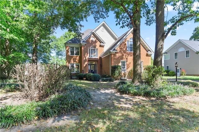 view of front of property featuring brick siding