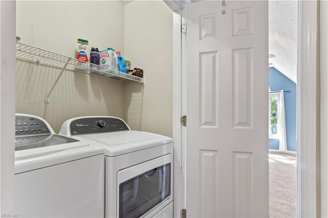 laundry area with carpet floors, laundry area, and separate washer and dryer