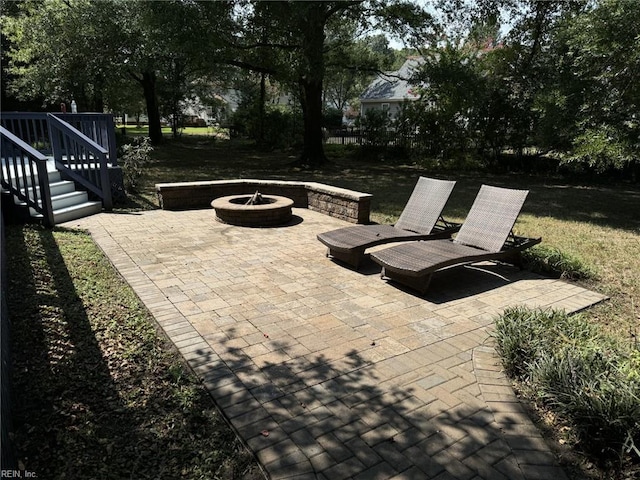 view of patio / terrace with an outdoor fire pit