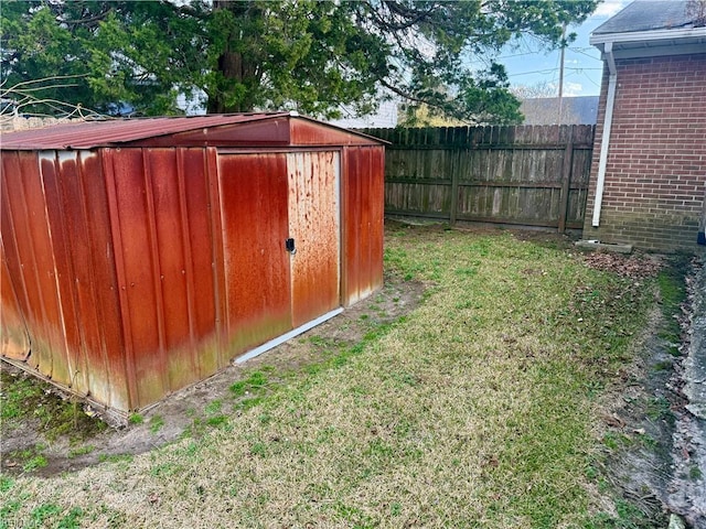 view of shed featuring fence