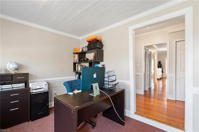 office space with baseboards, carpet, wood finished floors, and crown molding