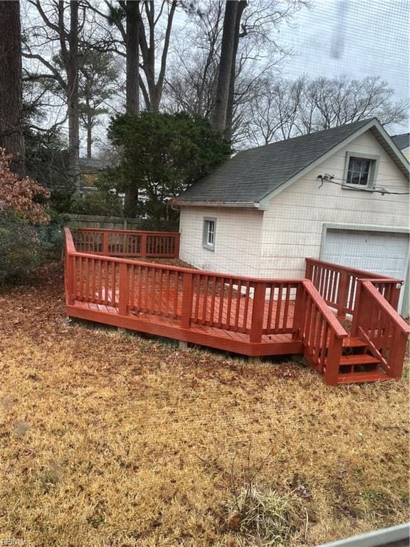 wooden terrace with an outbuilding