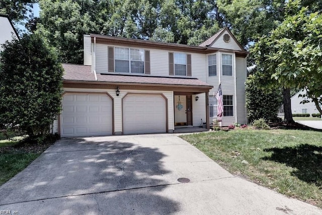 view of front of property featuring a garage, driveway, and a front lawn