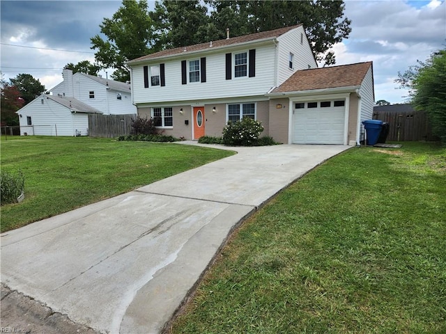 colonial inspired home featuring brick siding, an attached garage, fence, driveway, and a front lawn