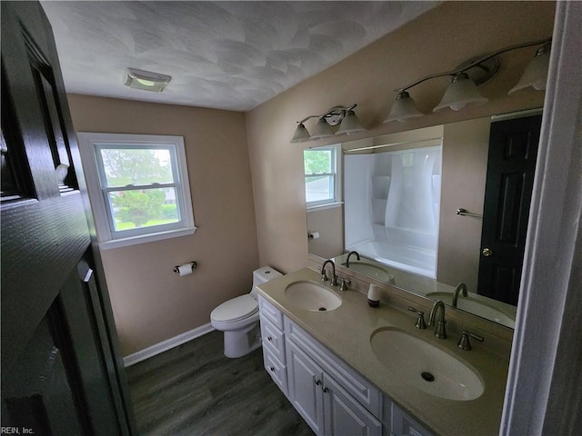 full bathroom with a sink and a healthy amount of sunlight