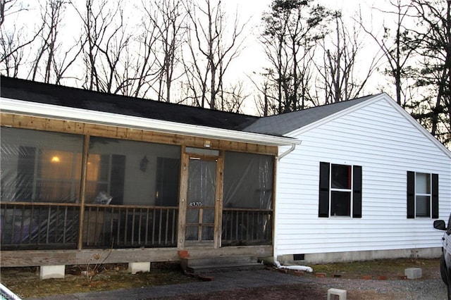 exterior space with crawl space and a sunroom