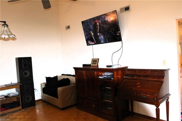 home office featuring visible vents and a ceiling fan