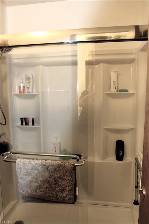 bathroom featuring a stall shower and tile patterned flooring