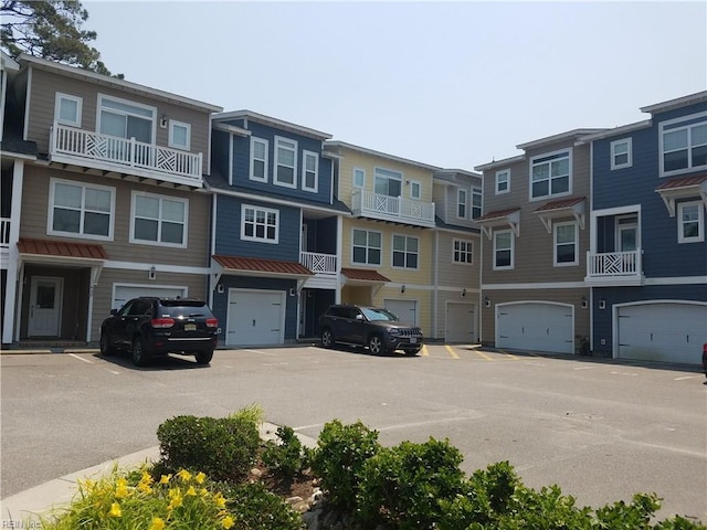 exterior space with a garage and a residential view