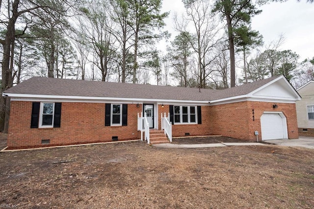 ranch-style home featuring crawl space, an attached garage, a shingled roof, and brick siding