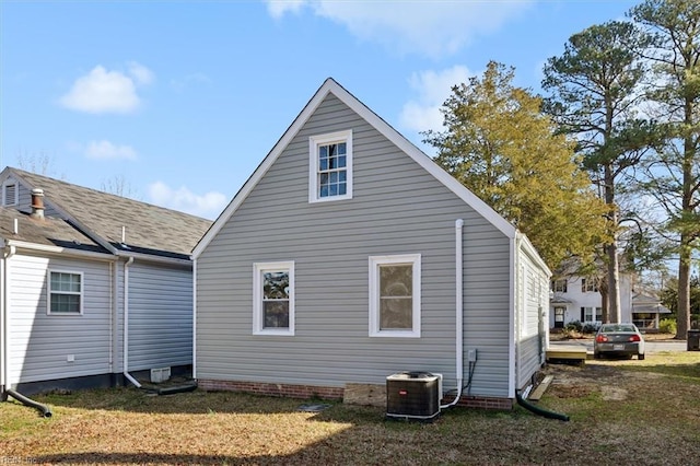 view of property exterior featuring a yard and cooling unit