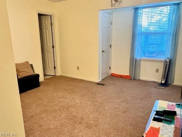 unfurnished bedroom with carpet and baseboards