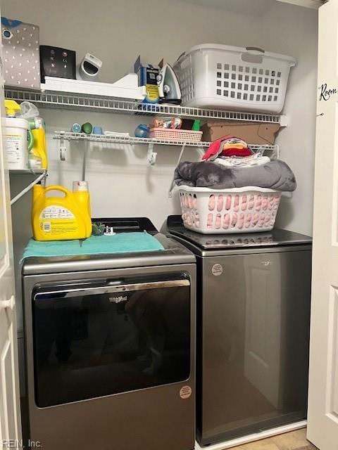 laundry area with laundry area and independent washer and dryer