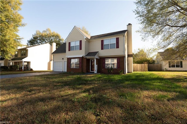 view of front of property with brick siding, fence, driveway, a front lawn, and a chimney