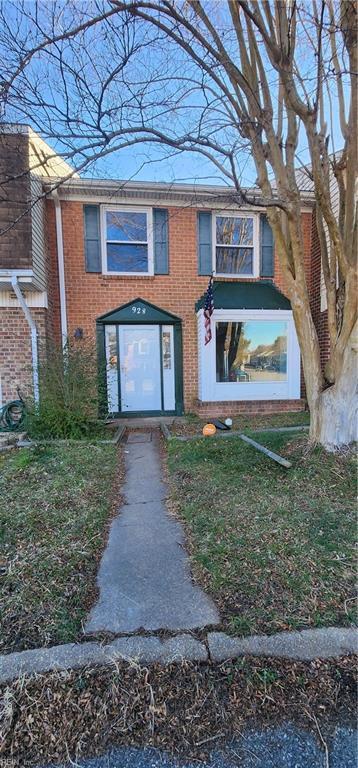 view of property featuring brick siding