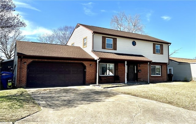 traditional-style house with a garage, driveway, brick siding, and a front lawn