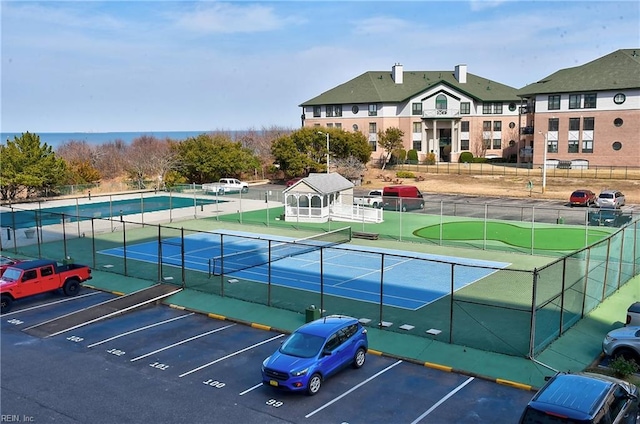 view of sport court with fence