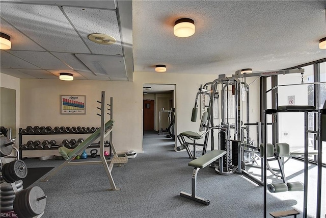 workout area featuring a textured ceiling