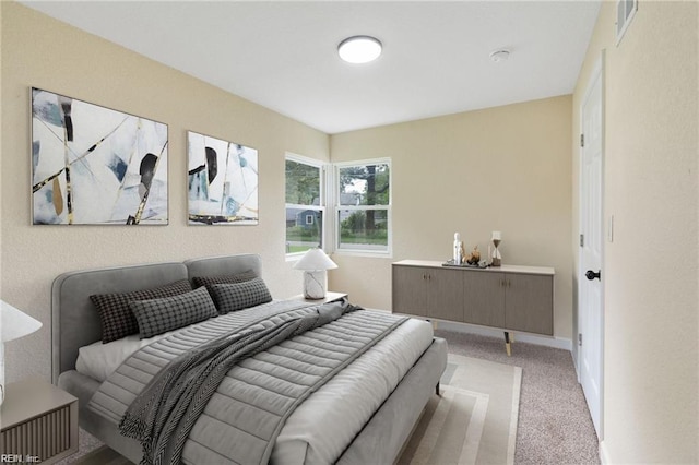 bedroom with carpet and baseboards