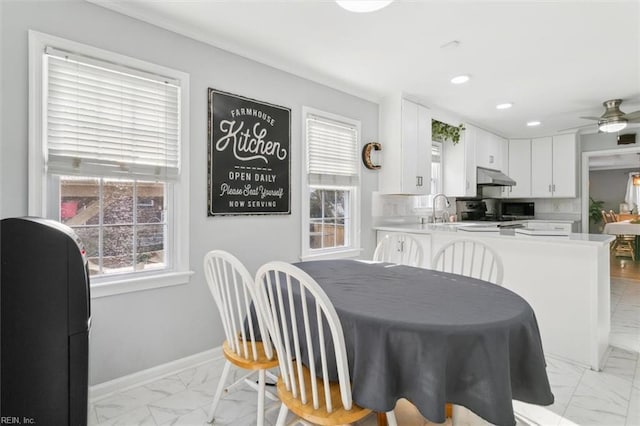 dining space featuring ceiling fan, marble finish floor, recessed lighting, and baseboards