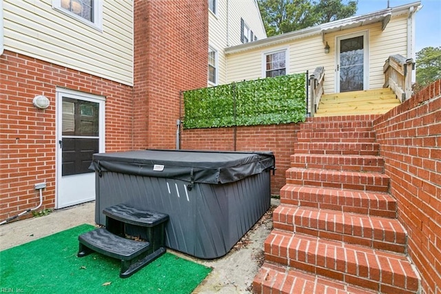 view of patio / terrace featuring a hot tub