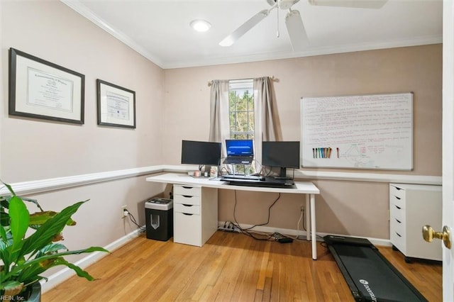 home office with light wood-type flooring, crown molding, baseboards, and ceiling fan