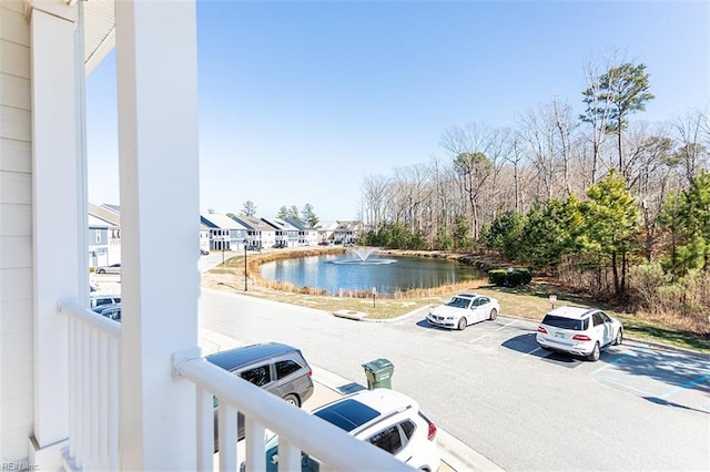 exterior space with a water view and a residential view