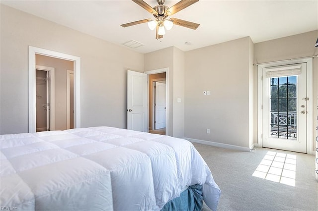 carpeted bedroom with access to exterior, ceiling fan, and baseboards