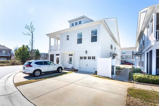 view of front of house with a garage and concrete driveway