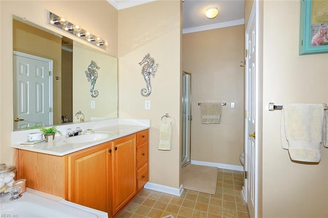 bathroom featuring crown molding, toilet, a stall shower, vanity, and baseboards