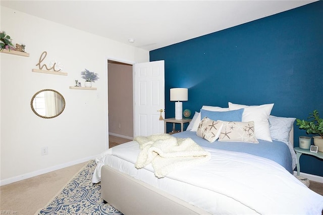 bedroom featuring carpet flooring and baseboards