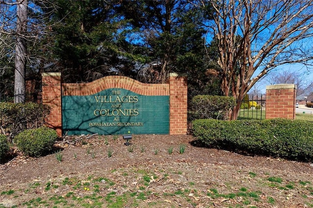 community sign featuring fence