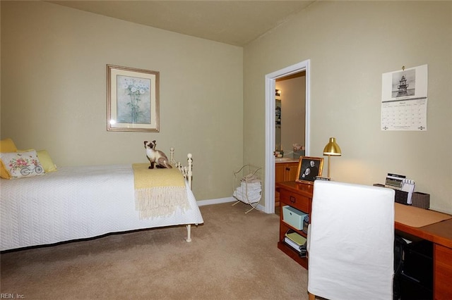 carpeted bedroom with baseboards