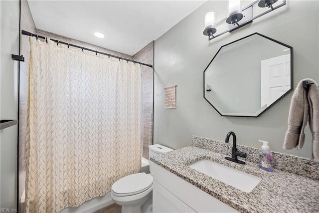 full bath featuring vanity, toilet, and shower / tub combo with curtain