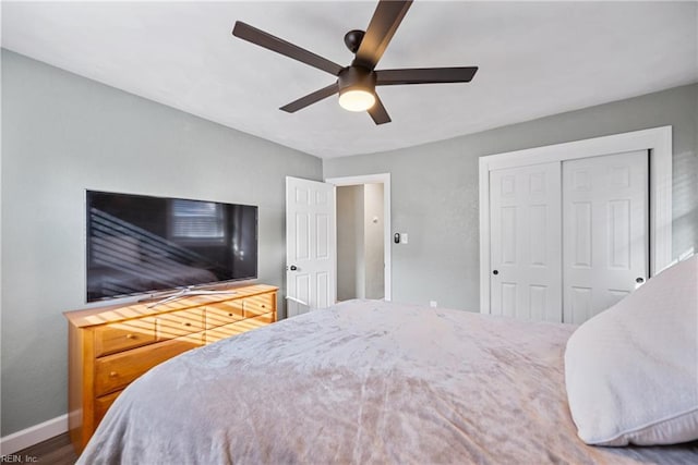 bedroom featuring a closet, a ceiling fan, and baseboards