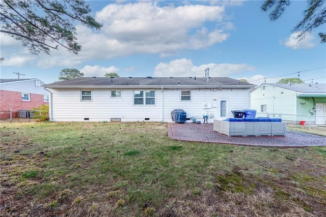 back of property with a patio, crawl space, fence, a yard, and outdoor lounge area