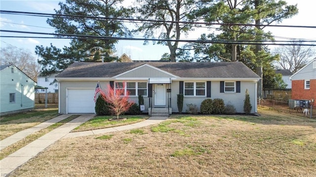 ranch-style home with an attached garage, brick siding, fence, driveway, and a front yard